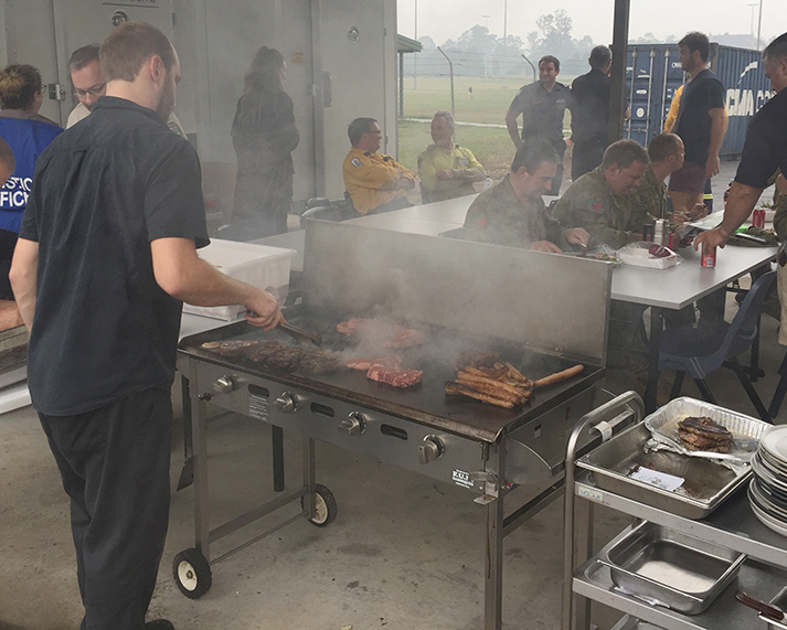 Man grilling meat.