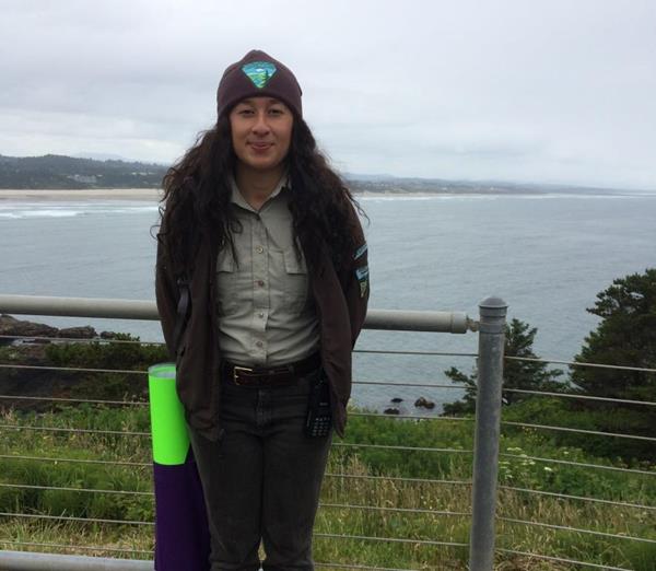 Denisse Escobar in front of an expanse of water. 