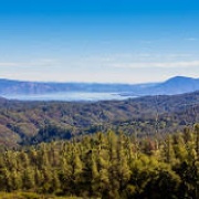 Photo of hills with lake in the distance