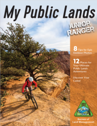 Cover of My Public Lands Junior Ranger Book, featuring a mountain bike rider on a desert landscape.