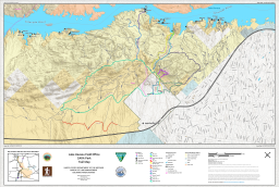 The map shows color-coded non-motorized trails including the Blue, Green, Red, Yellow (Crack-in-the-Mountain), and Lizard Peak/Table Top trails, as well as Ghost Road, Old Mining Road, Pilot Rock, Send It!, Sonny's Downhill, Trash Can, Trash Can Lid, Watershed Loop, and Downhill to Red Rock. Named campsites are shown along the Lake Havasu and Colorado River shoreline.