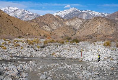 a wash at the base of two mountain ranges.