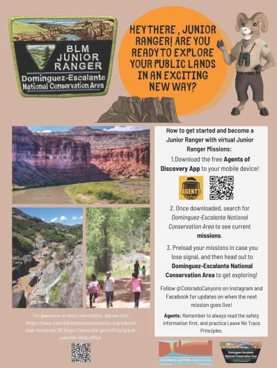 A photo showing a poster with instructions to download the Agents of Discovery app. The poster has two photos of a river, one in a canyon with tall red sandstone cliffs and the other in a canyon with dark gray rock formations. A third photo shows several children walking up a dirt road next to grass, sagebrush, and trees. 