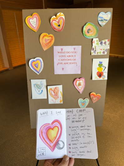 a poster board with painted hearts