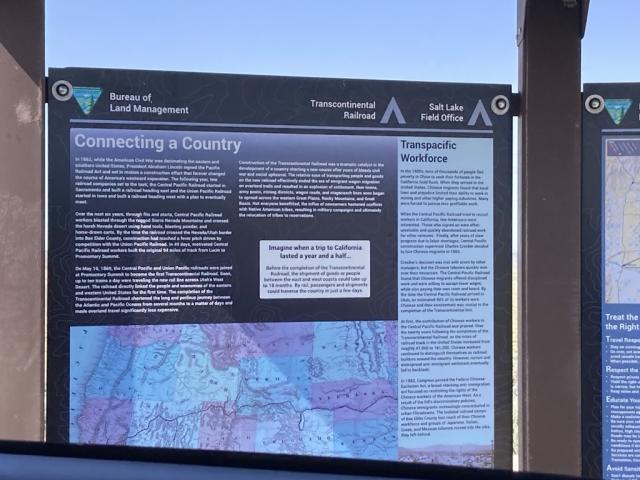 On one panel of the kiosk, a section titled “Connecting a Country” provides details about the history of the Railroad, while another section titled “Transpacific Workforce” describes how Chinese laborers helped build it. The panel also includes a map of the Railroad’s route through several states. 