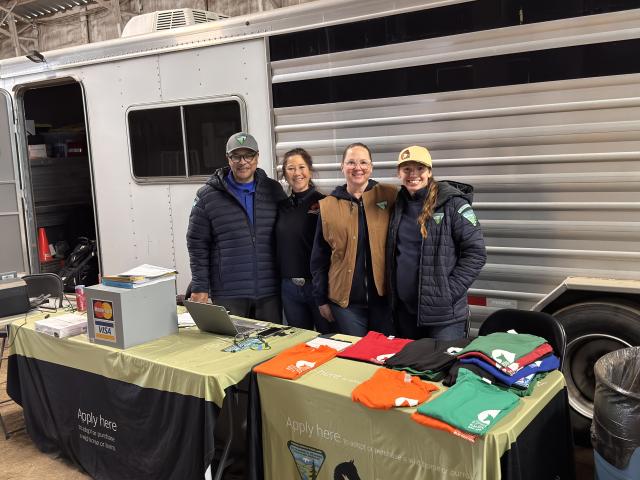 Photo by: Shannon McCrory (ES Director Mitchell Leverette poses with members of the office staff – Charmain “Q” DeHart, Donna Charleston, and Kelsey Radobicky - who assisted in processing the paperwork for all 145 placements)  
