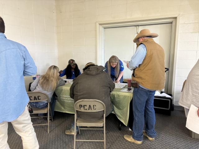 Lindsay Rasmussen, WHB Coordinator; and Alexelisha Luckett, Legal Instrument Examiner; help hopeful adopters complete their paperwork.    