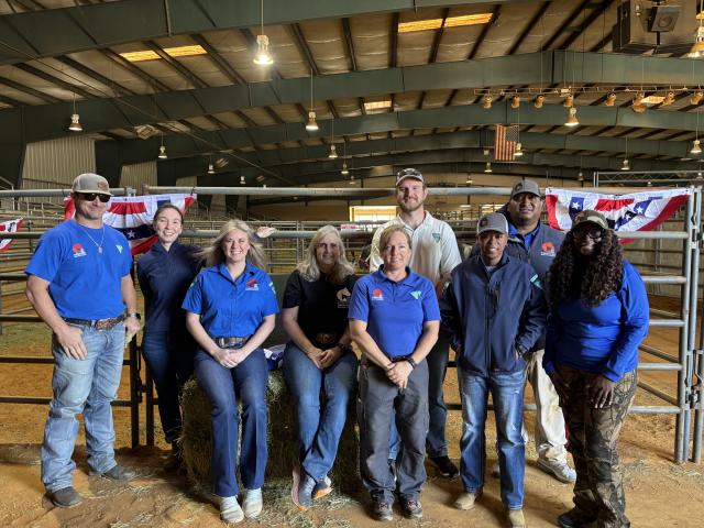 From Left to right: Matt Anderson, WHB Coordinator; Amanda Keener, Public Affairs Specialist; Lindsay Rasmussen, WHB Coordinator; Michelle Maraman, volunteer; Megan Velasquez, WHB Compliance Specialist; Hunter Paffrath, WHB Specialist; Marissa Thompson, WHB Compliance Specialist; Demetris Sanders, WHB Program Supervisor; and Alexelisha Luckett, Legal Instrument Examiner inside the Prentiss County Agri Center in Booneville, MS during a quiet moment at the WHB Placement Event. 