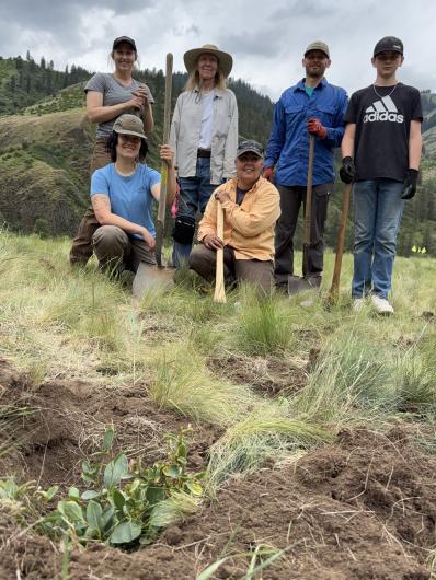 Image of people holding shovels