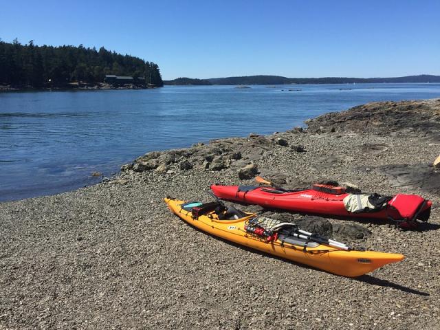 red and yellow kayaks on the shore of Blind Island