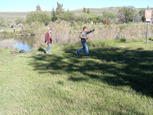 kids run to shore with their fishes