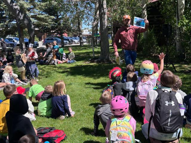 Stephen Dadio, paleontology coordinator for the BLM Pinedale Field Office, shares the story of Wyoming's prehistoric past with approximately 150 children at the Sublette County Public Library in Pinedale
