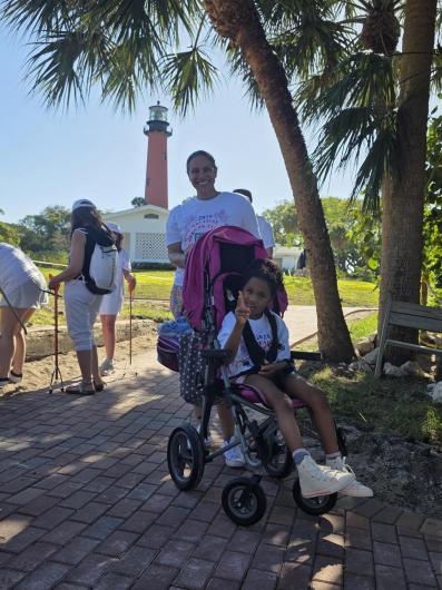 Volunteers pause for a photo in front of the iconic Jupiter Inlet Lighthouse.&nbsp;