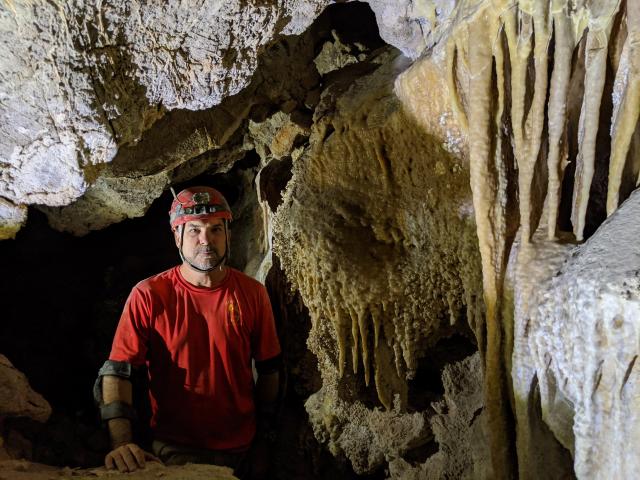 Kyle Voyles in a cave