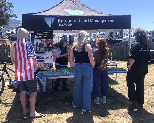BLM Booth with visitors.