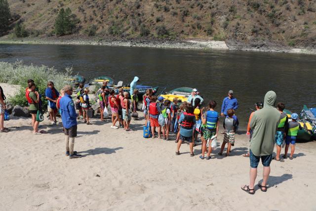 Students getting a lesson in river rafting.