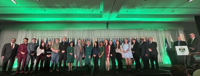 Participants stand on stage at Ignite by 4‑H as BLM Eastern States leaders outline the agency’s mission and encourage youth to explore careers in natural resource management and outdoor recreation.