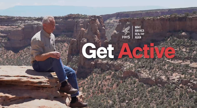 GetActive.gov video screenshot of Secretary Kennedy sitting on the edge of a canyon.