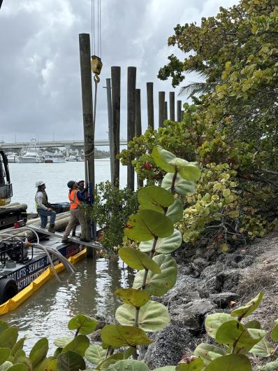America Strong staff make sure pilings are leveled & plumb.