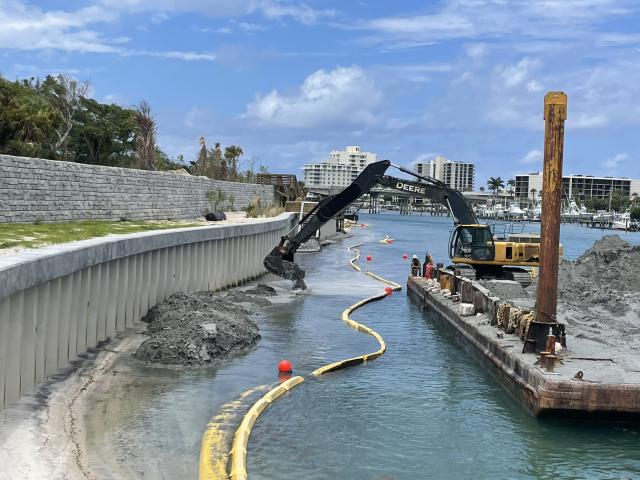 Barge sand was placed on beach in front of sheet pile wall 