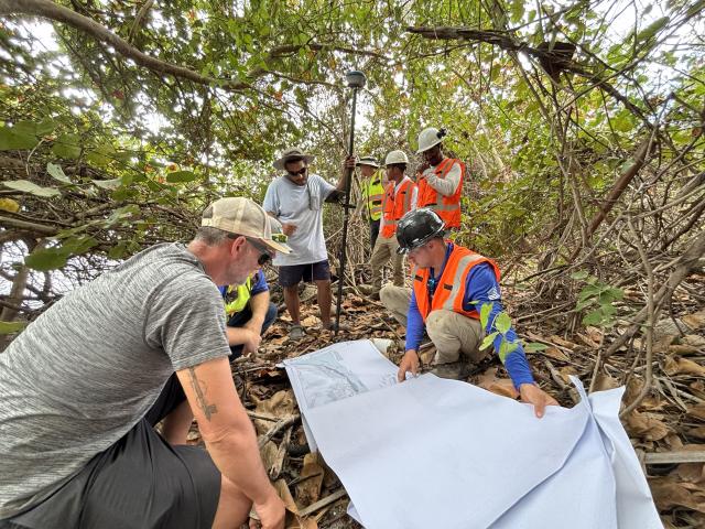 BLM, BDI, Taylor Engineering, and America Strong staff look at construction documents for upcoming boardwalk. 
