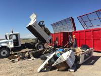 volunteers use heavy equipment and hand tools to clean north rim of Snake River Canyon