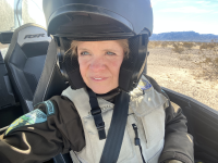 Closeup of Ranger Wostal in a helmet on an off-road vehicle