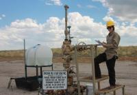 A BLM intern works at an oil and gas property in Fremont County, Wyoming in 2015.