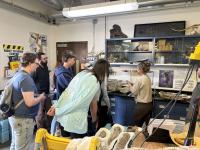 People look around inside a lab