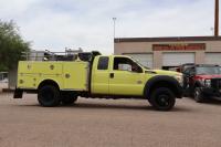 Wildland fire engine in front of fire department.