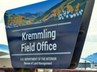 Photo of official BLM Kremmling Field Office sign in front of the field office building