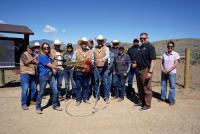 Group photo cutting the rope for the Bear Creek parking lot trailhead 