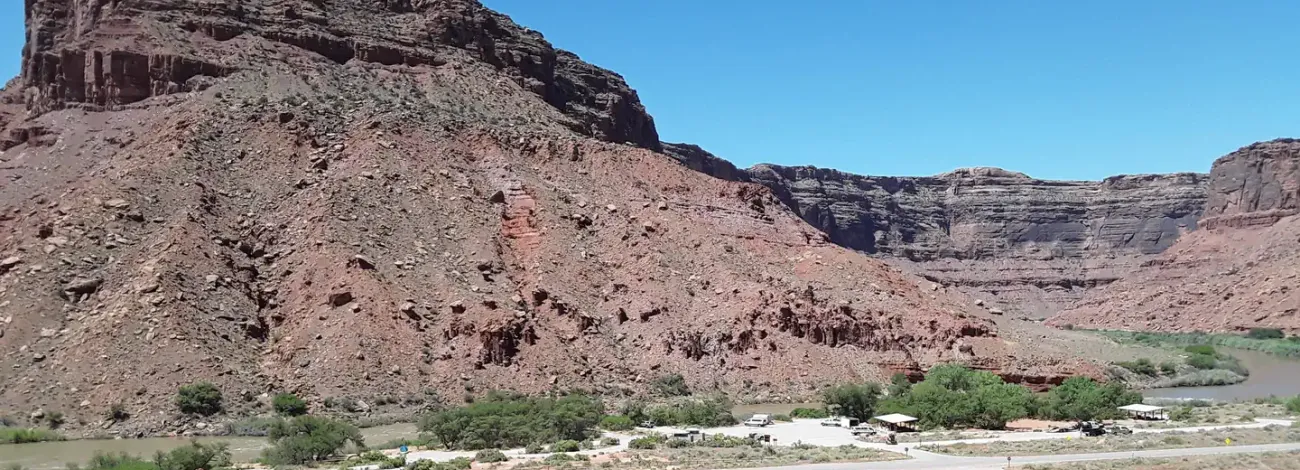 Broad view of Big Bend Campground with Colorado River and red rock canyon walls