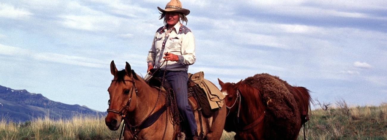 Person on horseback, with another horse following, rides along the Oregon National Historic Trail, photo by BLM