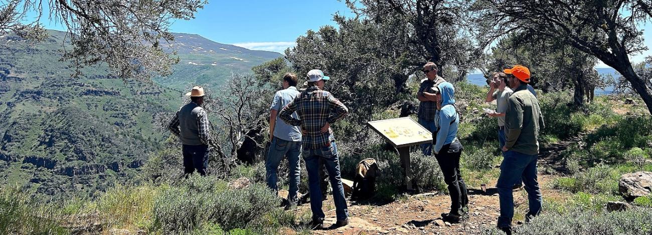 group from the Steens Mountain Advisory Council gathered outdoors