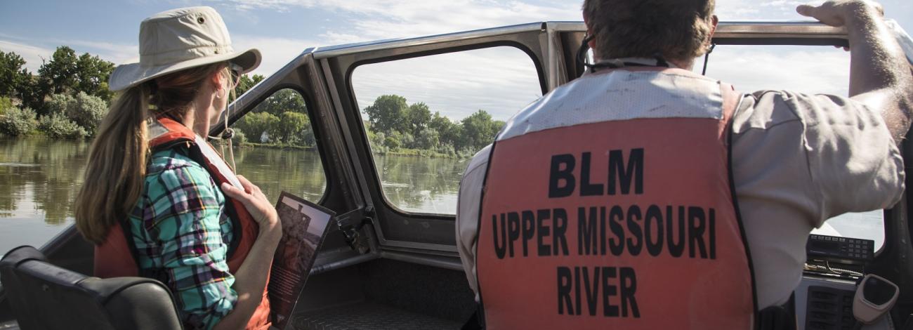 river rangers on a  boat