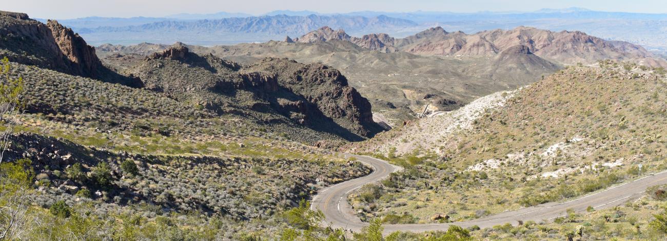 A winding road passes through mountains
