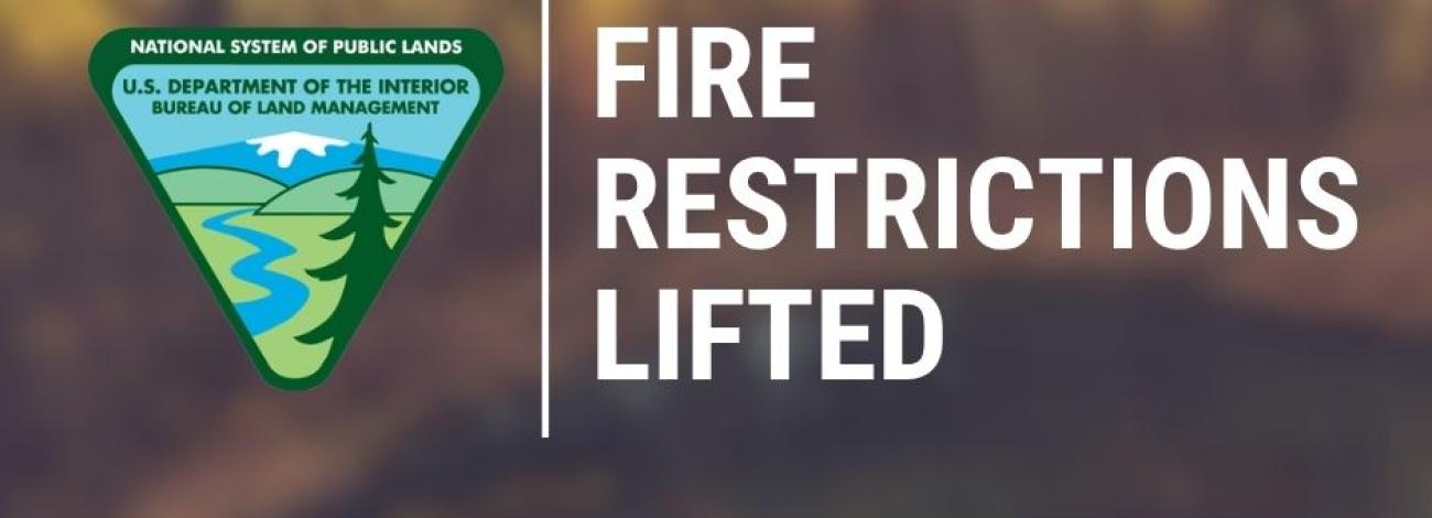 Text saying FIRE RESTRICTIONS LIFTED GRAPHIC with blurry background