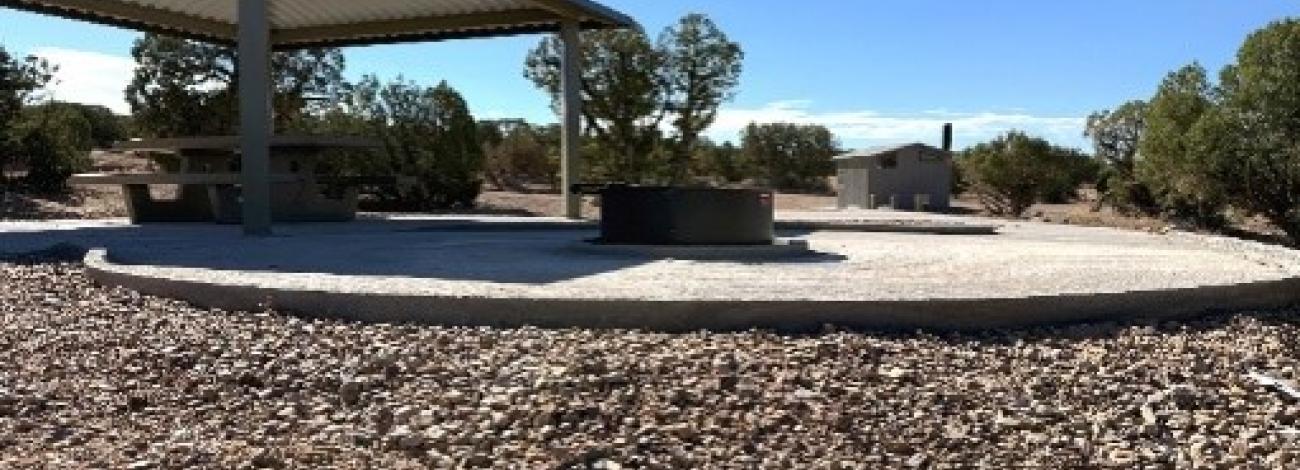 An accessible campsite with concrete pad and hangover. 