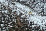 Olathe Spray Service aircraft distributes seed on the Bull Draw fire burn area