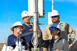 petroleum engineering technicians inspecting equipment. 