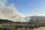 Border 6 Fire. (Photo by Robert Hermes) smoke in the air and a blue sky