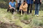 Image of people holding shovels