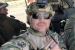 A close up of a man in uniform giving a thumbs up.