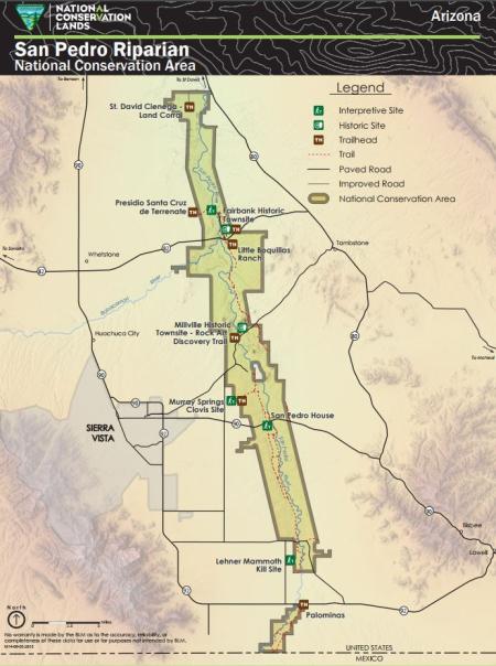 A map of the San Pedro Riparian National Conservation Area in Cochise County, southeastern Arizona. The NCA boundary is shown with a dark olive outline following the San Pedro River from the United States-Mexico border northward. The San Pedro River is shown in blue running the length of the NCA. Named sites shown include Fairbank Historic Townsite, Lehner Mammoth Kill Site, Little Boquillas Ranch, Millville Historic Townsite and Rock Art Discovery Trail, and more.